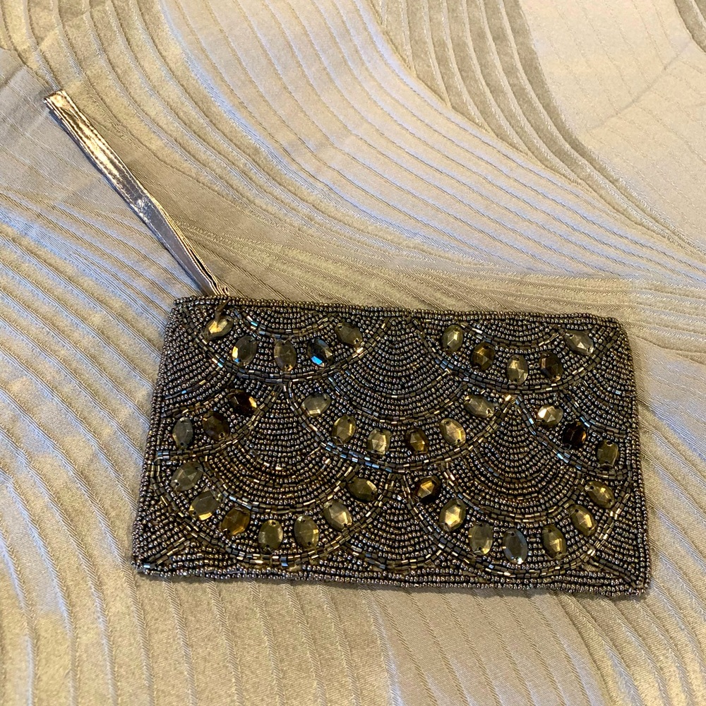 Women’s gold beaded wristlet bag